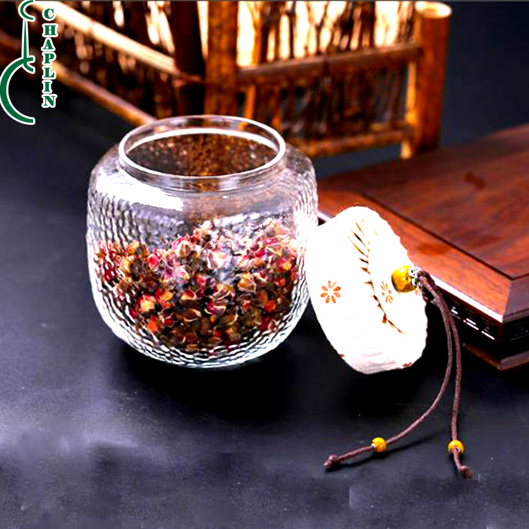Wholesale heat resistant hexagonal glass jar with cloth lids for tea